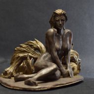 A statue of a Kumiho with intricate details on its fur and tails.