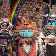 A colorful rendition of Saquasohuh surrounded by celestial symbols