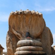 An intricate statue of Seshnag, with multiple heads and tails