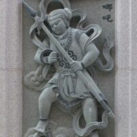 Wall carving of Nezha, The Chinese Child God of Courage and Mischief