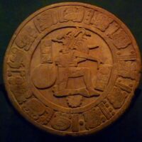 Ancient disc depicting Hun Hunahpu, the Maize God.