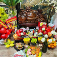 "Shrine dedicated to Ong Dia, the Earth God, showing offerings and symbolic carvings.