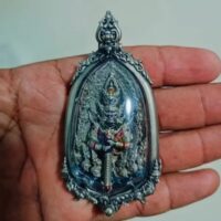 "Amulet depicting Thao Wessuwan, believed to bring wealth and safeguard the wearer."