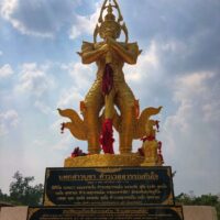 "Statue of Thao Wessuwan, showing intricate details of the guardian deity in a standing pose."