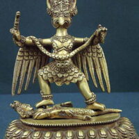 Figurine of Apung Galura with outstretched wings and storm motifs carved into the base.