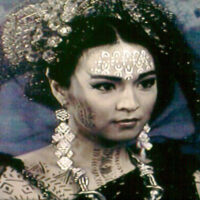 Cosplayer as Magwayen, goddess of the sea, in ocean-themed costume.