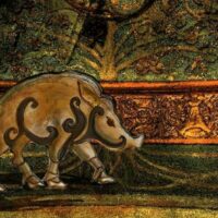 Fantasy-style artwork of Moccus emerging from the woods, flanked by glowing boars, with swirling Celtic patterns in the background.