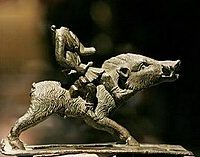 Small figurine of Moccus,posed in a stance of readiness.