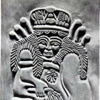 Stone carving of Ninhursag, depicted with a crown and traditional Sumerian motifs.