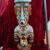 Ruaumoko tiki carving with traditional patterns representing volcanic and earthquake energy.
