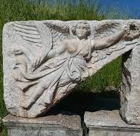 Stone carving of Greek Goddess Bia