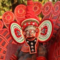 Mythlok - Karinkutty theyyam Theyyam dancer symbolising Kerala spirit Karinkutty