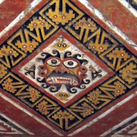 Wall carving of the Moche creator god Ai Apaec