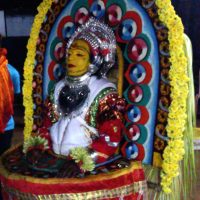 A bhuta kola performer dressed as Chavundi
