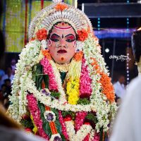 A bhuta kola performer dressed as Chavundi