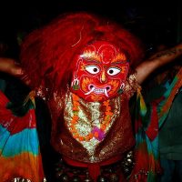 A dancer wearing the traditional Lakhey mask