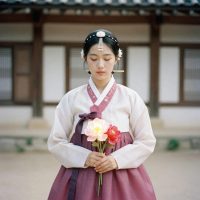 Bari Gongju, the Korean goddess of the afterlife, depicted as a serene young woman in humble travel-worn clothing