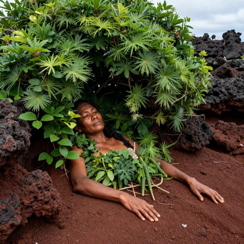 Sleeping Lady Spirit (Mahkontowe), portrayed as a colossal ancestral woman reclining across a tropical island landscape